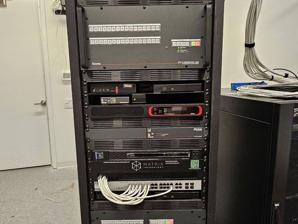 Dressed and labeled equipment rack with patch panels and network switching